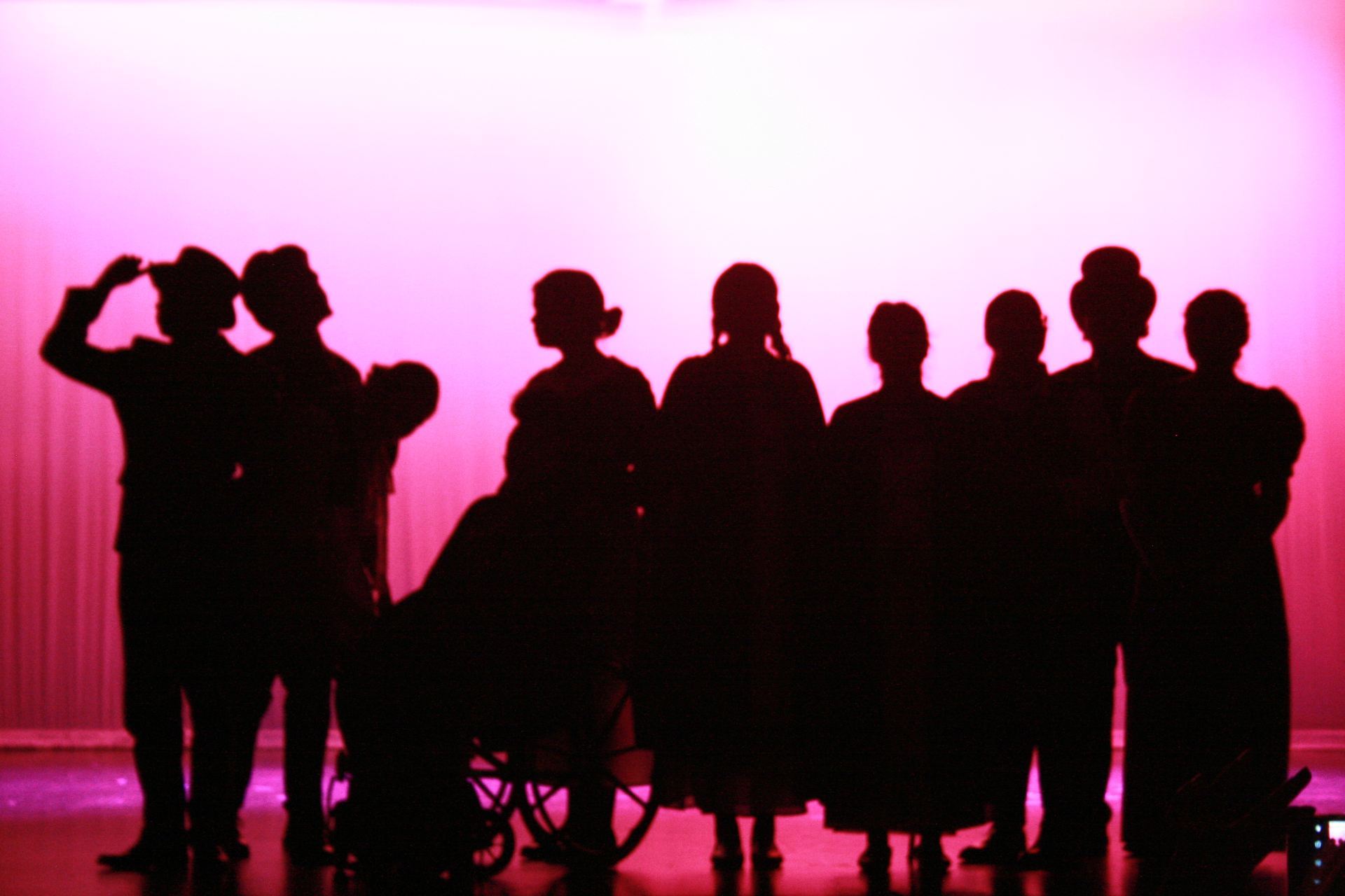 Silhouette of actors on stage
